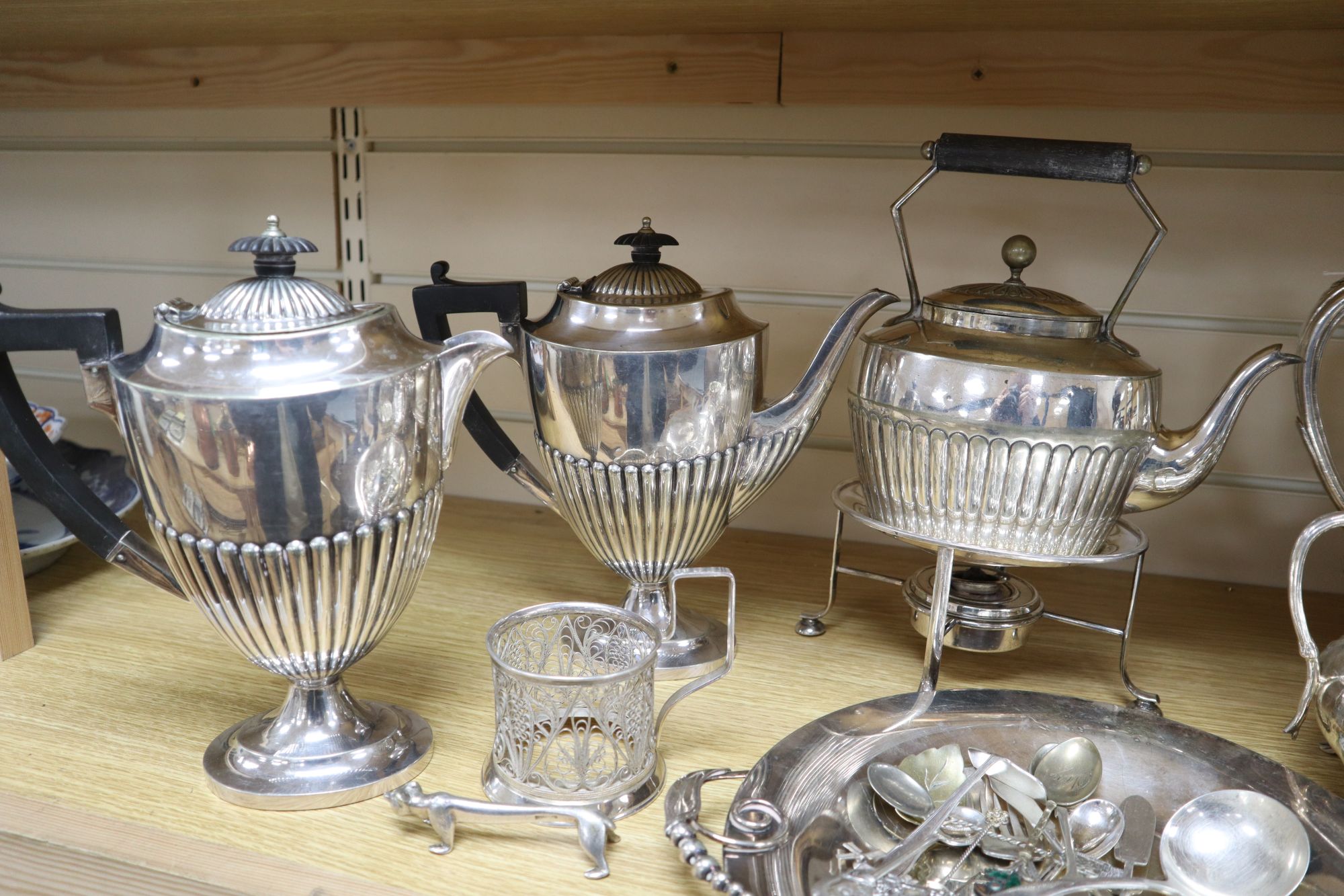 A three-piece plated teaset, sundry plated items and a leather box with plated mounts